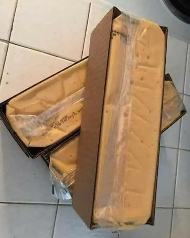 Boxes of the iconic government cheese, a symbol of food assistance distributed to families in the 1980s and 1990s, used for everything from sandwiches to casseroles