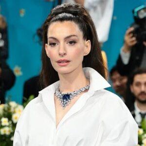 Anne Hathaway stuns at the 2025 Met Gala, debuting a sharp, modern look that signals a bold new chapter in her style journey.